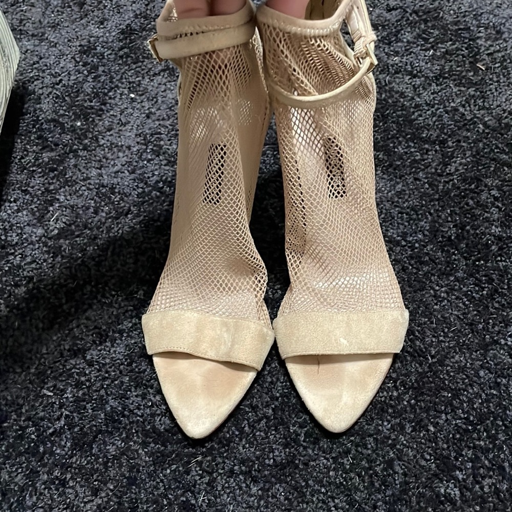Nine West tan peep to booties . Zipper closure in back of heel. Size 8